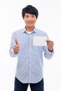 Young asian man showing empty card and showing thumb. Royalty Free Stock Photo