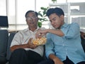 The young asian man spending good lifestyle time with older father on mobile technology together