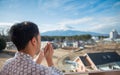 Young asian man stand looking Mount Fuji