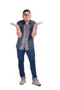 Young Asian Man Standing Wearing Batik Shirt, Shrug Gesture Royalty Free Stock Photo