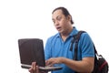 Young Man Gasping, Shocked Expression Looking at Laptop