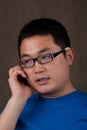 Young asian man talking on the phone Royalty Free Stock Photo