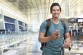 Young asian man traveling with suitcase and mobile phone Royalty Free Stock Photo