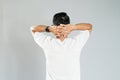 a young asian man turned around with his hands behind his head Royalty Free Stock Photo