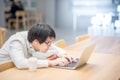 Young Asian man university student doing homework Royalty Free Stock Photo