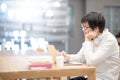 Young Asian man university student lifestyle in library Royalty Free Stock Photo