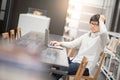 Young Asian man university student working in library Royalty Free Stock Photo