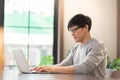 Young Asian man using laptop Royalty Free Stock Photo