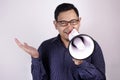 Young Businessman Smiling Shouting Using Megaphone, Marketing Promotion Concept Royalty Free Stock Photo