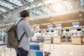 Young asian man waiting for airport check in Royalty Free Stock Photo