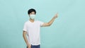 Young Asian man wear mask and present empty spaces Royalty Free Stock Photo