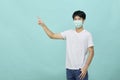 Young Asian man wear mask and present empty spaces Royalty Free Stock Photo