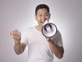 Young Man With Megaphone Advertisement Concept, Smiling Expression Royalty Free Stock Photo