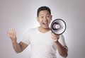 Young Man With Megaphone Advertisement Concept, Smiling Expression Royalty Free Stock Photo
