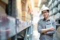 Asian man doing stocktaking by using tablet in warehouse Royalty Free Stock Photo