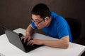 Young asian man working on his laptop computer Royalty Free Stock Photo