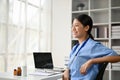 Young Asian medical student smiling and sitting in the study room Royalty Free Stock Photo