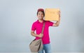 Young Asian Men delivery Services Carrying parcels on the chase and Shoulder Bags with check list paper delivery service concept Royalty Free Stock Photo