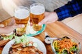 Young asian man drinking beer and clink glasses happy while enjoying home party Royalty Free Stock Photo