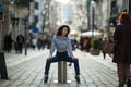 Young asian mixed-race woman is posing on the St. Catarina street, Porto