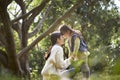 Asian mother and daughter having a good time outdoors in park Royalty Free Stock Photo