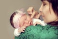 Young Asian mother holding the shoulder of the baby Royalty Free Stock Photo