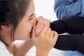 Young asian mother kiss foot of little baby girl on bed in bedroom at home, mom and newborn with relationship and bonding. Royalty Free Stock Photo