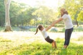 Young asian mother and little daughter playing the park with fun and happiness, family enjoy and relax and leisure together Royalty Free Stock Photo