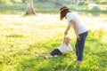 Young asian mother and little daughter playing the park with fun and happiness, family enjoy and relax and leisure together Royalty Free Stock Photo