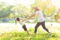 Young asian mother and little daughter playing the park with fun and happiness Royalty Free Stock Photo