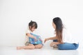 Young Asian mother taught her little daughter about reading English characters, family concept