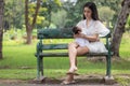 Young Asian mothers or single mom are carrying newborn babies. Family doing activities and relaxing in the park. Concepts about