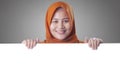 Young Muslim Woman Smiling Behind Blank White Board Royalty Free Stock Photo