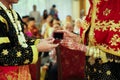 Young Asian muslim couple holding small box containing wedding rings