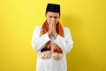 Young Asian Muslim man feel sad with covering his face with hands. Copy space concept Royalty Free Stock Photo