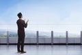 Young asian muslim man praying with raising hand in the balcony Royalty Free Stock Photo