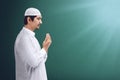 Young asian muslim man praying to god Royalty Free Stock Photo