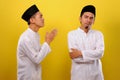 Young Asian Muslim men ignore the apologize of his Muslim`s brother. Bad Attitude in Ramadan