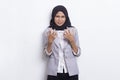 Young asian muslim woman angry emotional shouting and screaming on white background Royalty Free Stock Photo