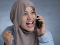 Young Woman Angry by Phone Call, Screaming on Phone Royalty Free Stock Photo