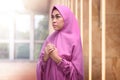 Young asian muslim woman in hijab dress praying Royalty Free Stock Photo