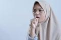 Young asian muslim woman sick coughing with cold or sore throat