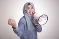 Asian muslim woman Shouting with Megaphone, Leader, Supporter or Protester Royalty Free Stock Photo