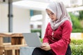 Young asian muslim woman working on laptop outdoor Royalty Free Stock Photo