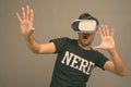 Young Asian nerd man using virtual reality headset Royalty Free Stock Photo