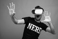 Young Asian nerd man using virtual reality headset Royalty Free Stock Photo