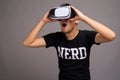 Young Asian nerd man using virtual reality headset Royalty Free Stock Photo