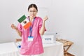 Young asian nurse woman at political campaign election holding mexico flag screaming proud, celebrating victory and success very Royalty Free Stock Photo