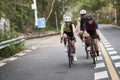 Young Asian people cycling on rural road Royalty Free Stock Photo