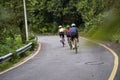 young asian people cycling on rural road Royalty Free Stock Photo
